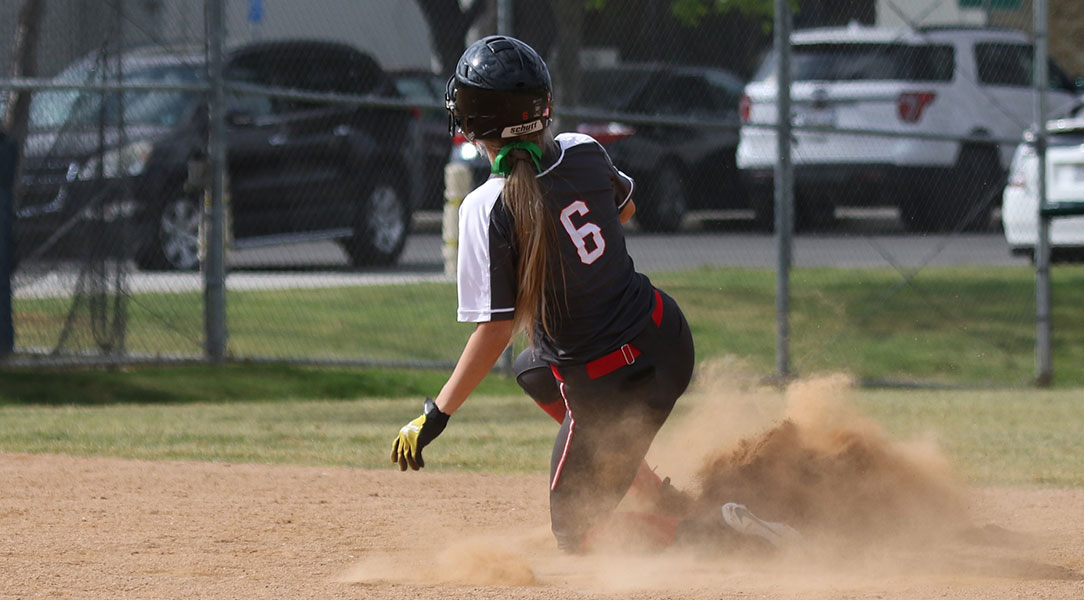 Michaela Foisy slides into second base.