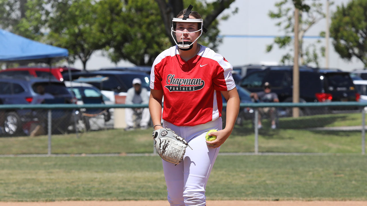 Jillian Kelly stands and readies to deliver a pitch on the softball field.