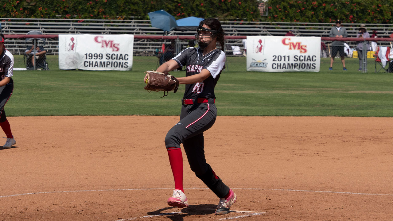 Simi Lauwers winds up to deliver a pitch on the softball field.
