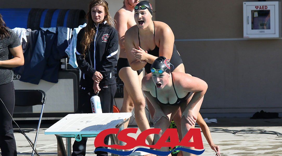 Members of the women's swim and dive team cheer on their teammates.