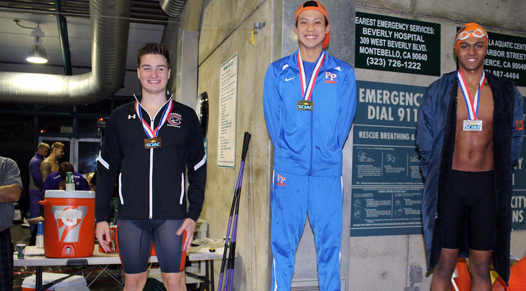 William Crewe stands on the third place podium.