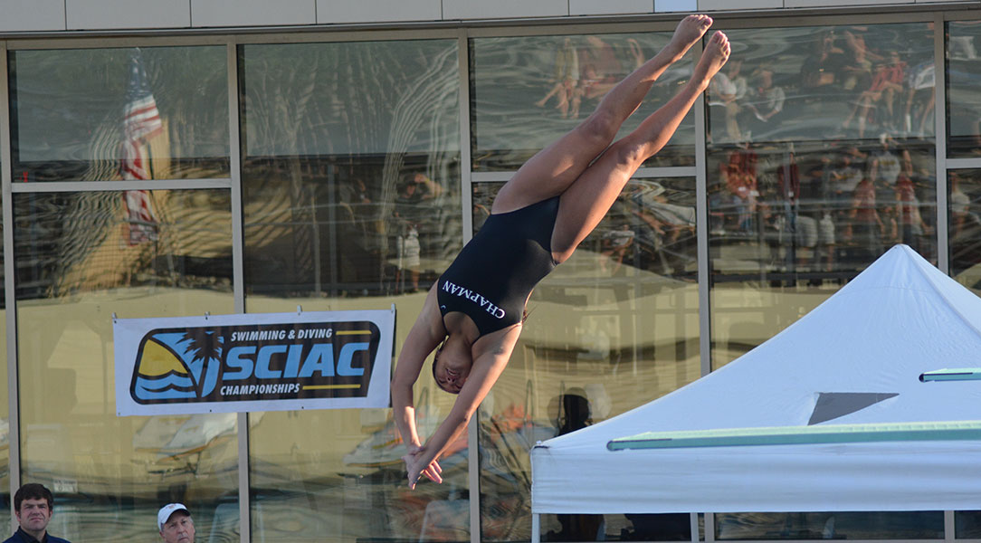 A female diver flips in the air.