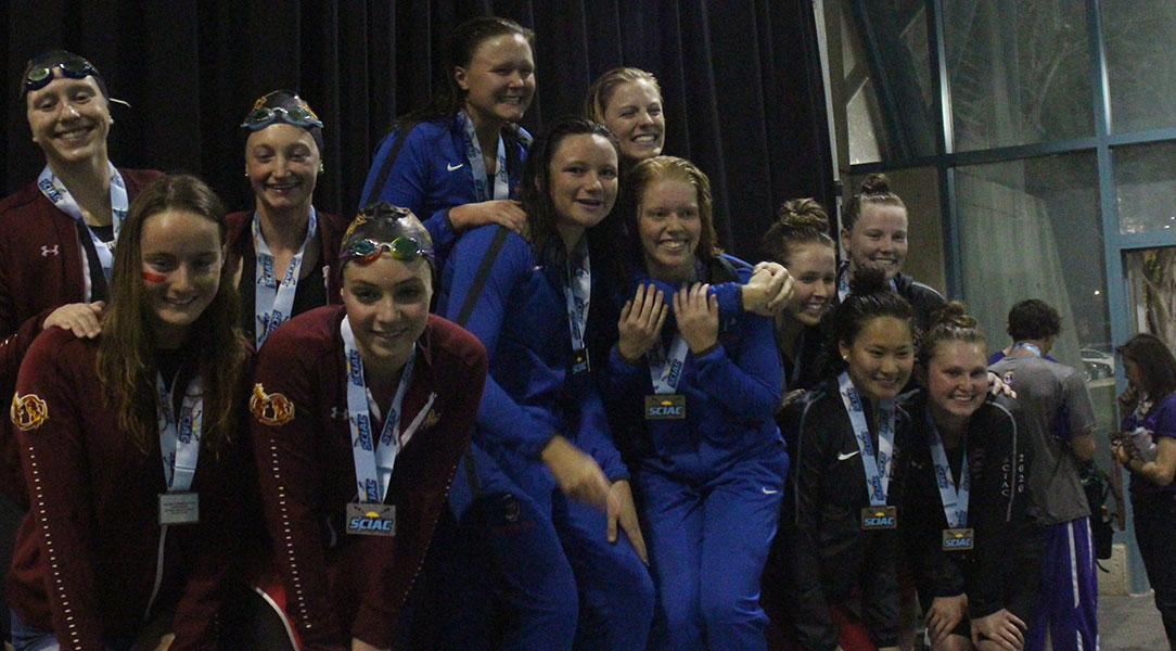 The top three teams gather on the podium.