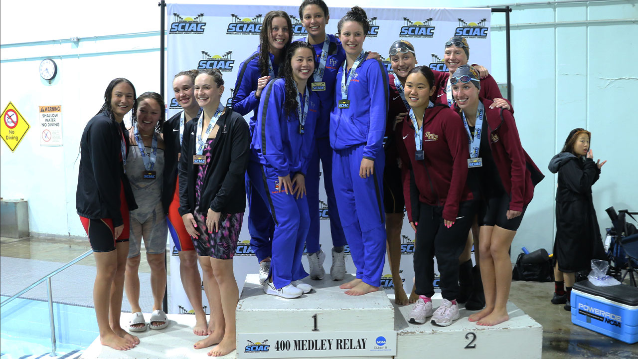 Three award-winning swimming relay teams on the podium.