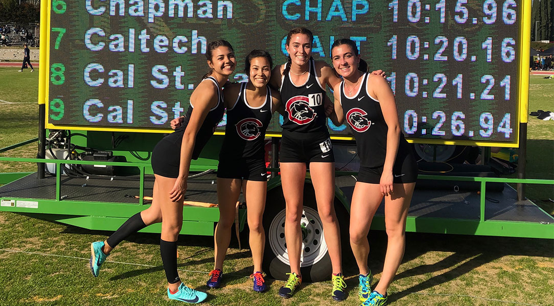 The 4x800 team celebrates the school record.