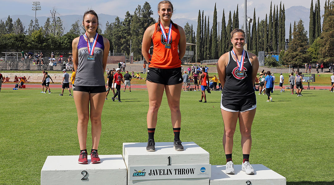 Maija Girardi stands on the podium.