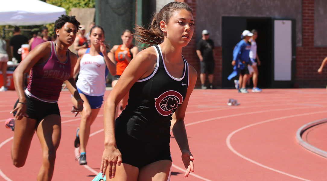 Gabi Siguenza runs around the curve.
