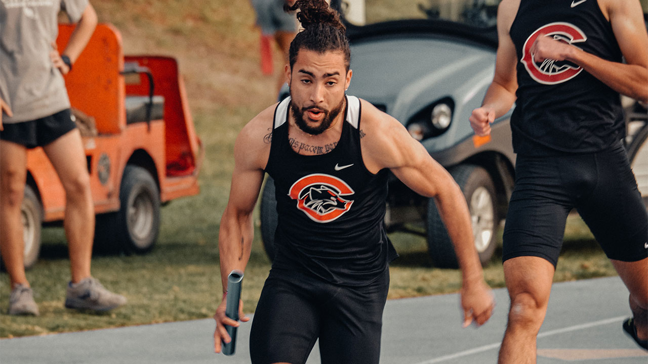 Donovan runs with the baton in a relay.