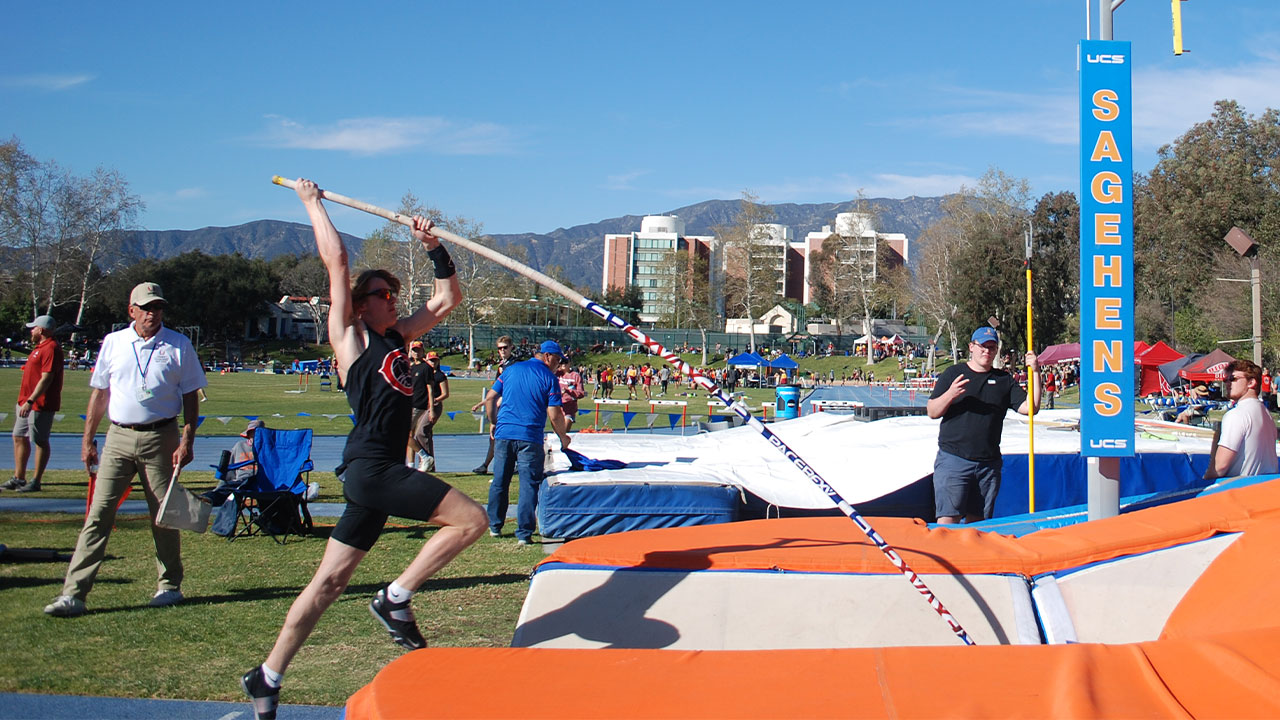 Jesse McMillen jumps to start his pole vault.