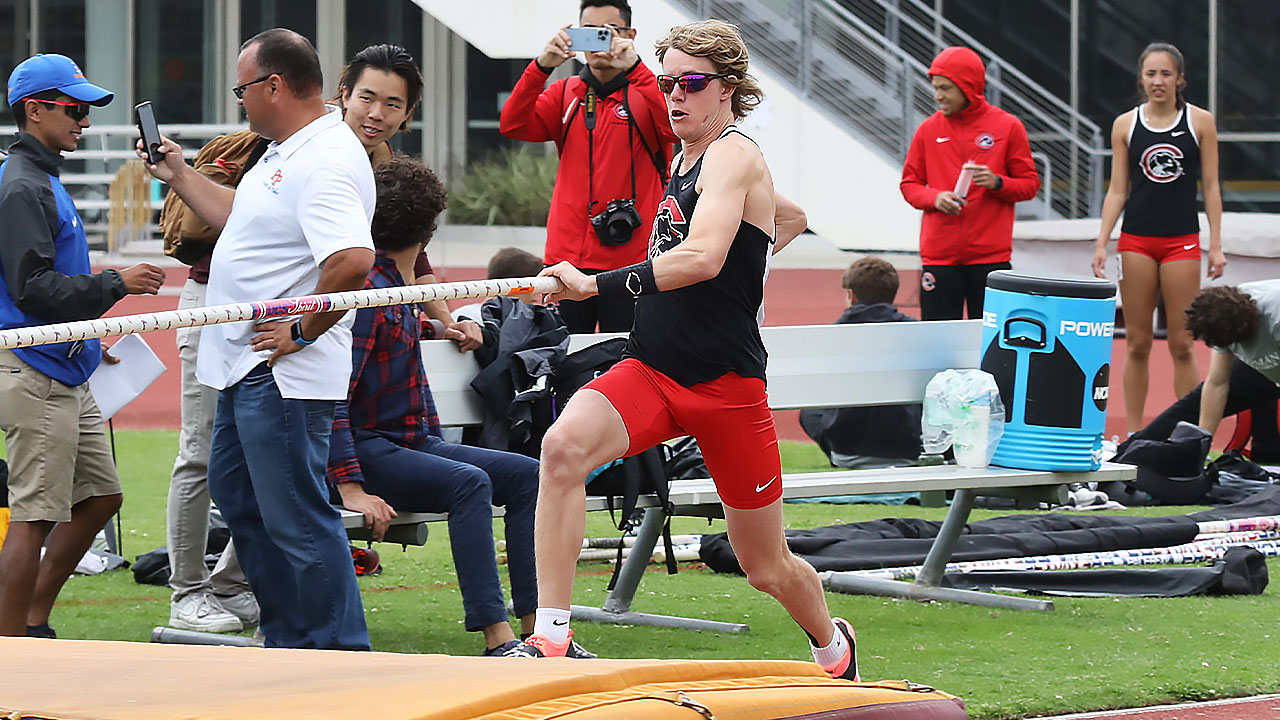 Jesse McMillan runs down the pole vault runway.