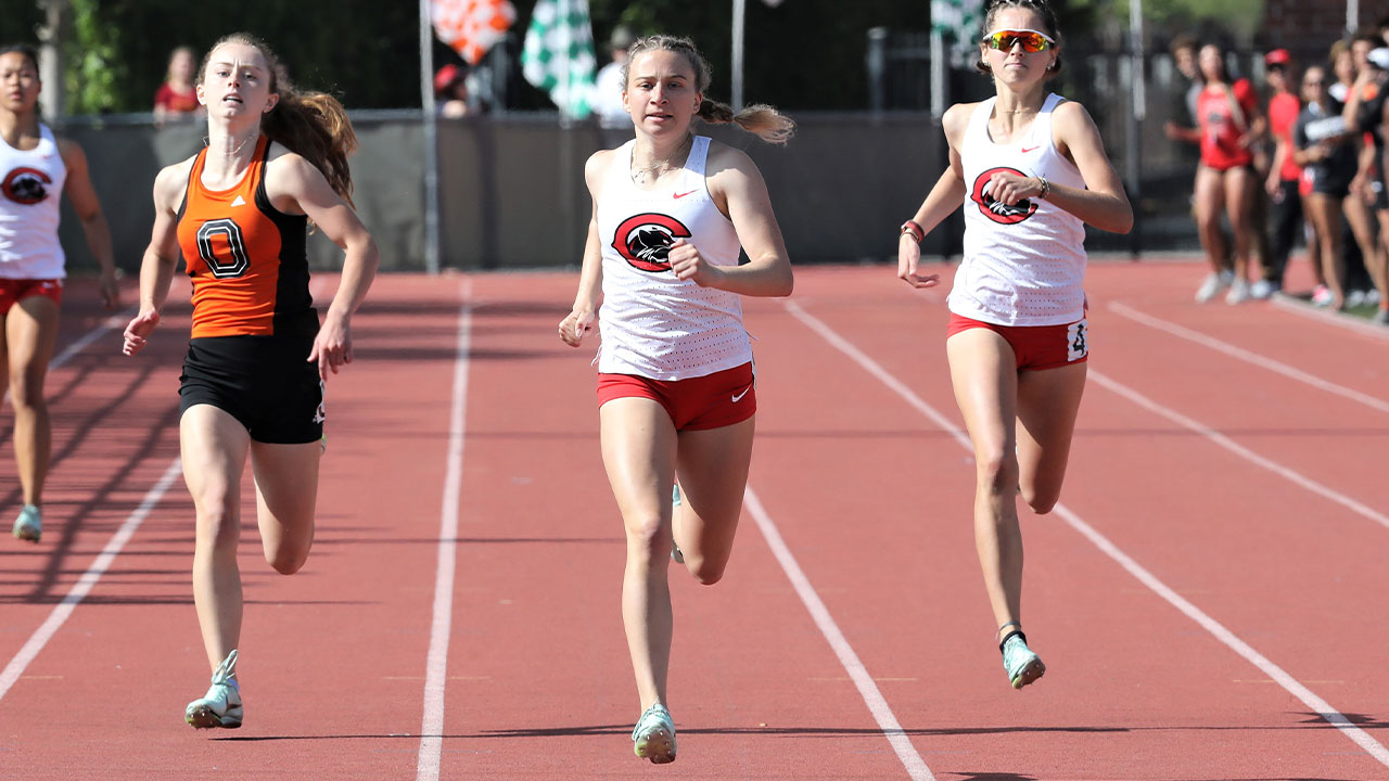 Allie Kremer sprints ahead of her competitors down the straightaway.