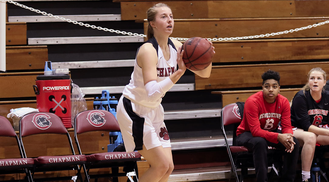 Lucy Criswell shoots a three pointer.