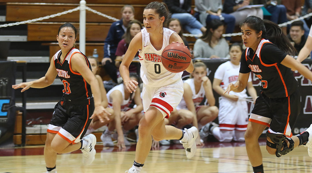 Marissa Dunn dribbles down the court.
