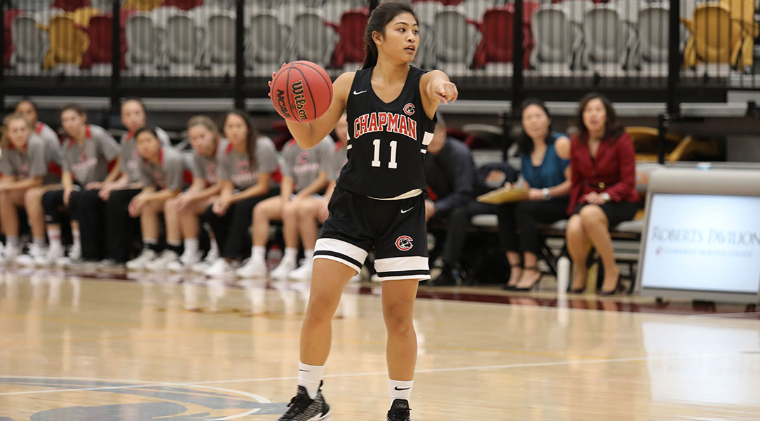 Jaryn Fajardo dribbles down the court and directs her teammates.