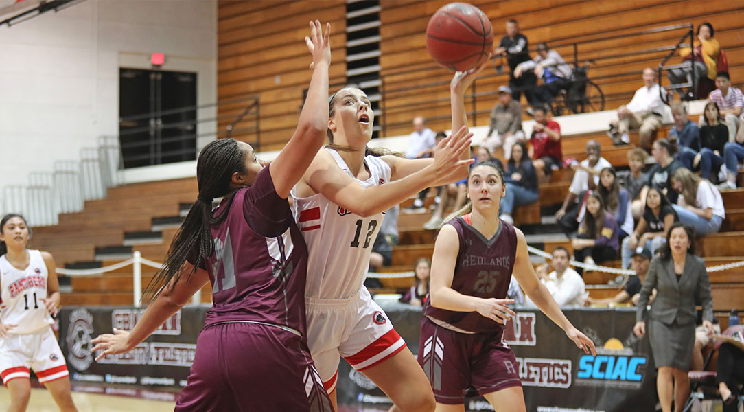 Julia Strand shoots over a defender.
