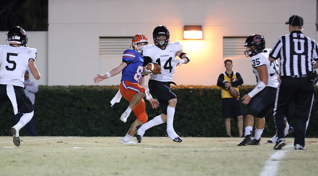 Nathan Parkin intercepts a throw and runs it back for a few yards.