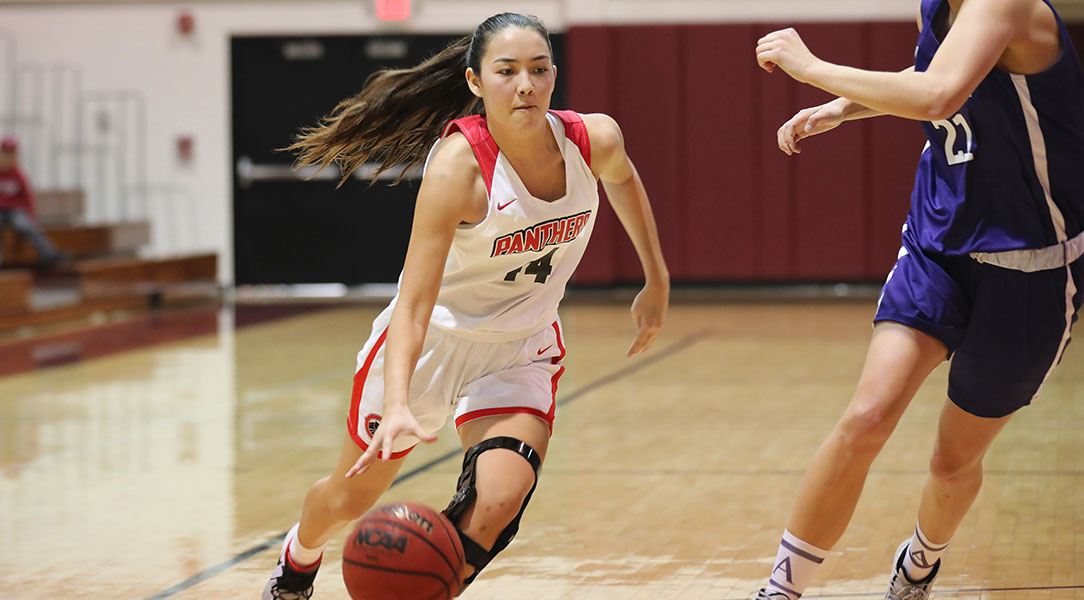 Brittany McPherson dribbles to the basket.