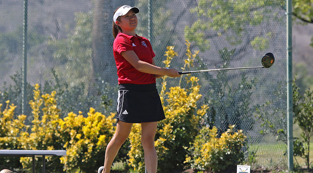 Marisa Bhanubandh watches her tee shot.