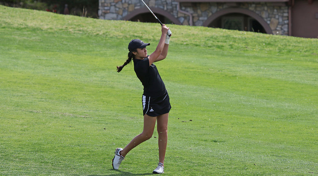 Emily Lewis hits the ball.