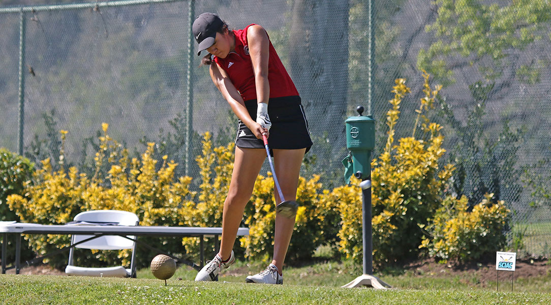 Emily Lewis tees off.