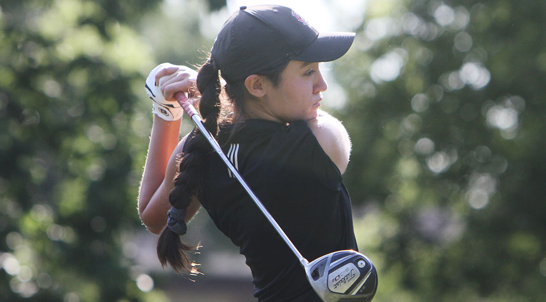 Emily Lewis tees off at the NCAA Championships.