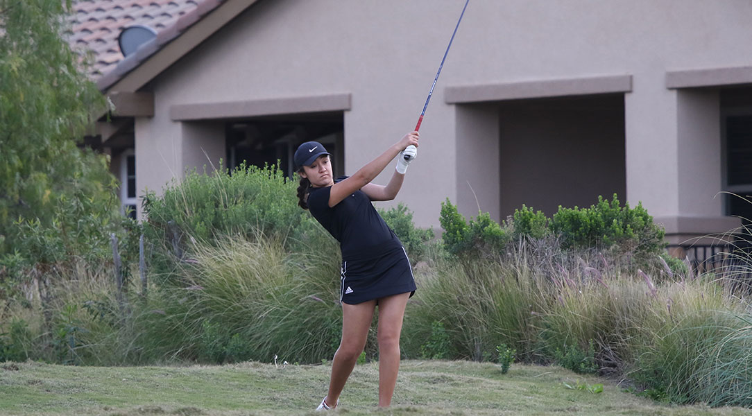 Emily Lewis hits the ball.