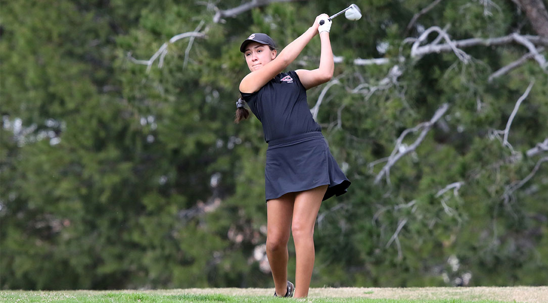 Emily Lewis tees off.