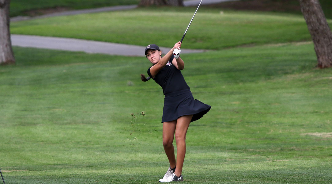 Emily Lewis hits from the fairway.