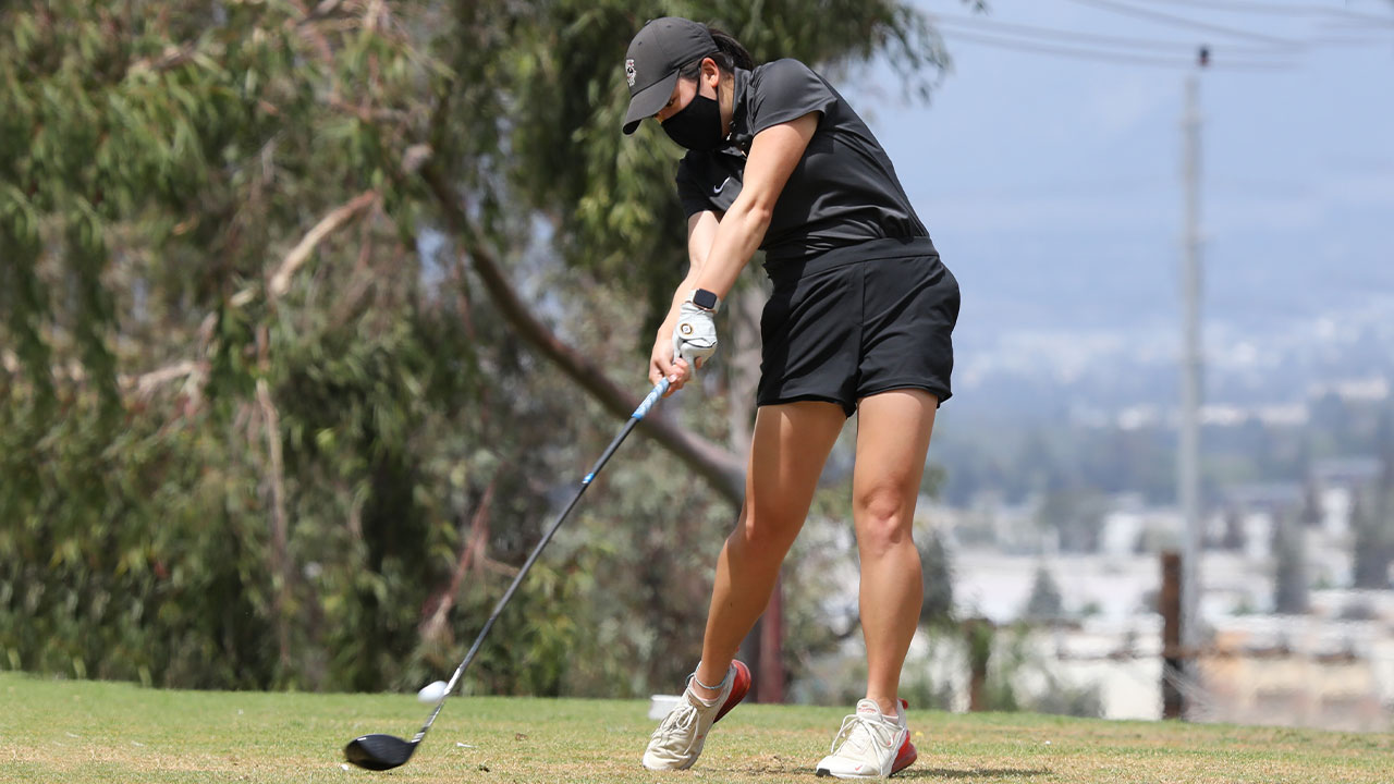 Kristen Lee tees off with a driver.
