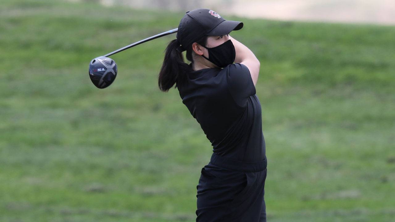 Kristen Lee watches her tee shot.