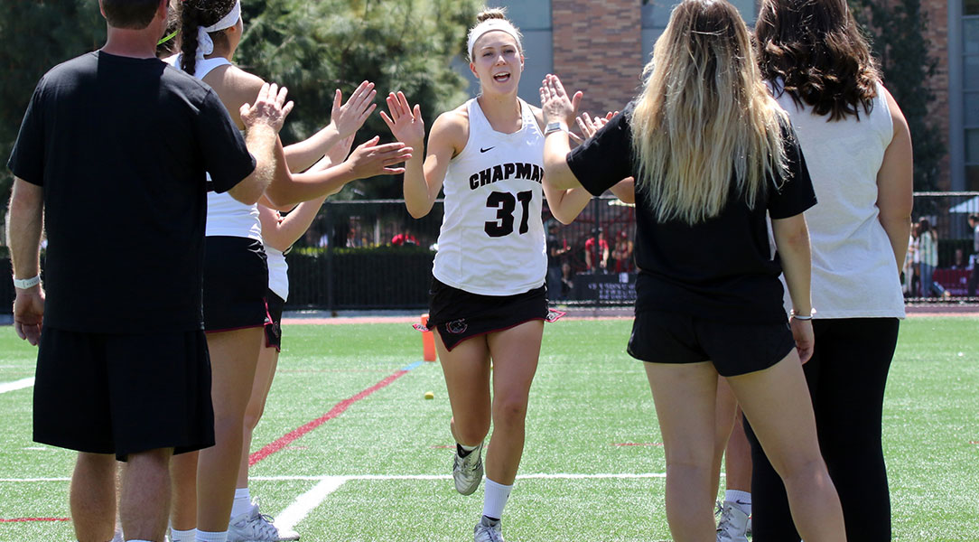 Stacey Zuppa high-fives her team as she is introduced.