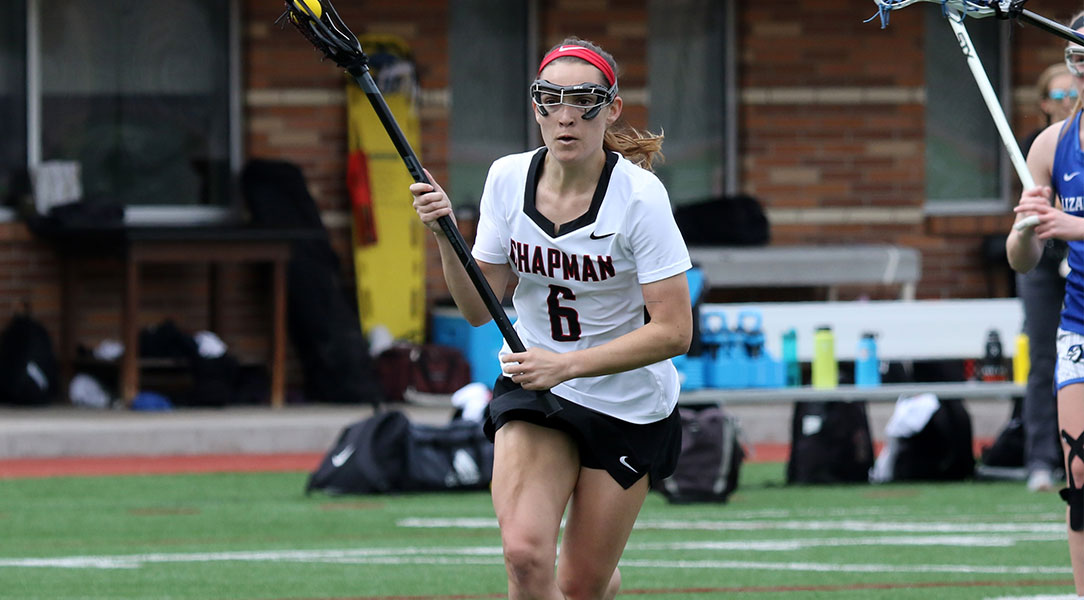 Lucy Schwartz runs with the ball down the field.