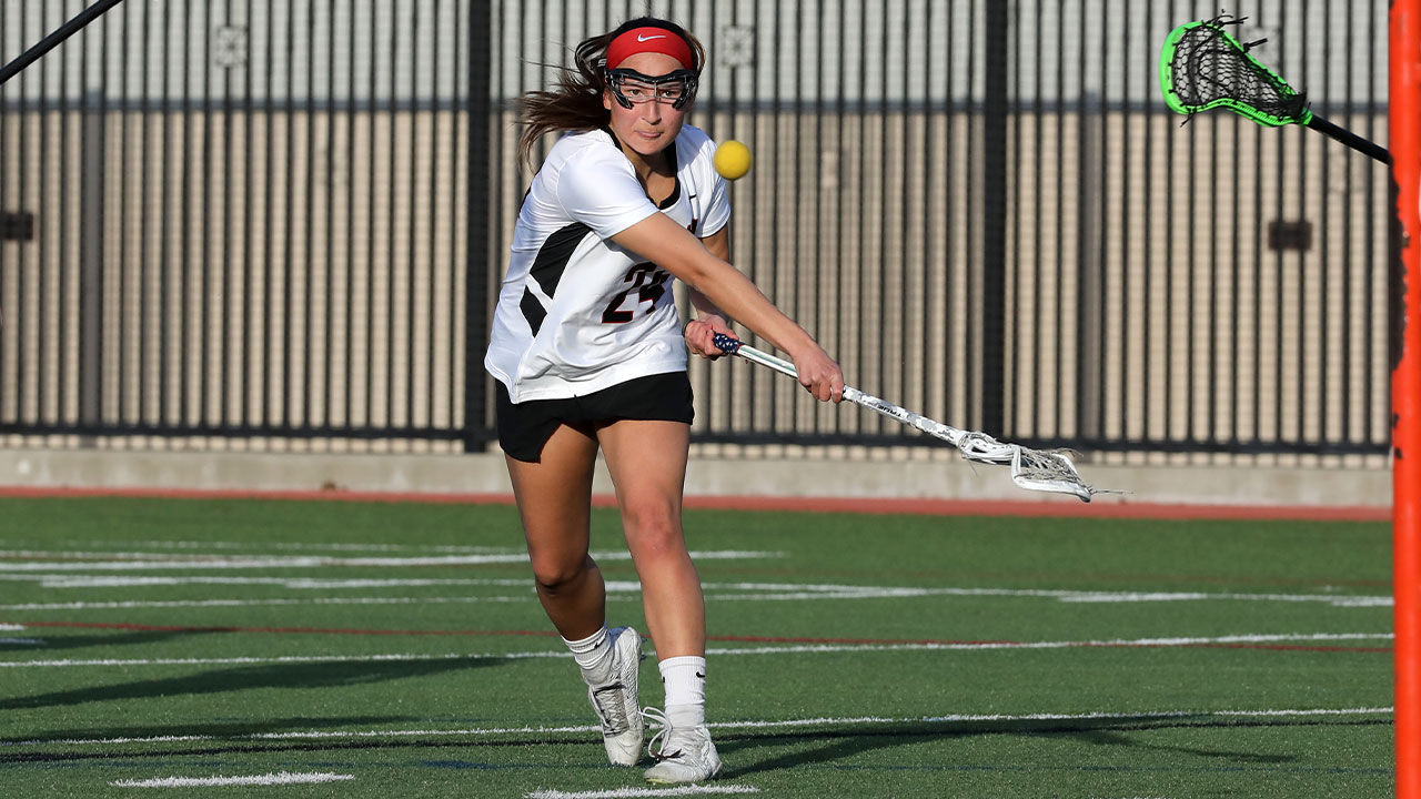 Mei-Lani Ferreira takes a shot at the lacrosse goal.