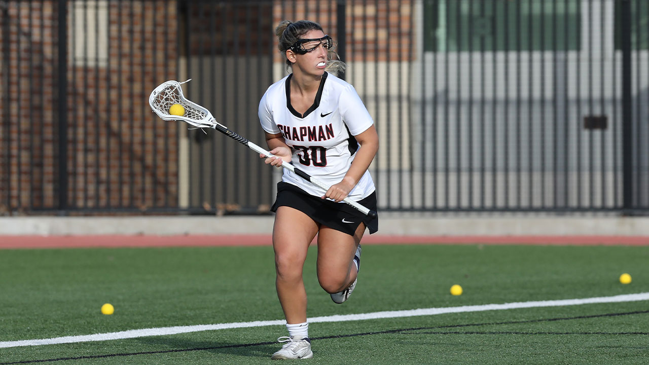 Sophia Bitis runs behind the goal and looks to pass to a teammate.