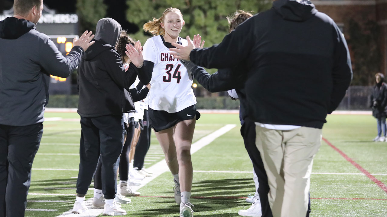 Jessica Ricketts high fives teammates as she is introduced as a starter.