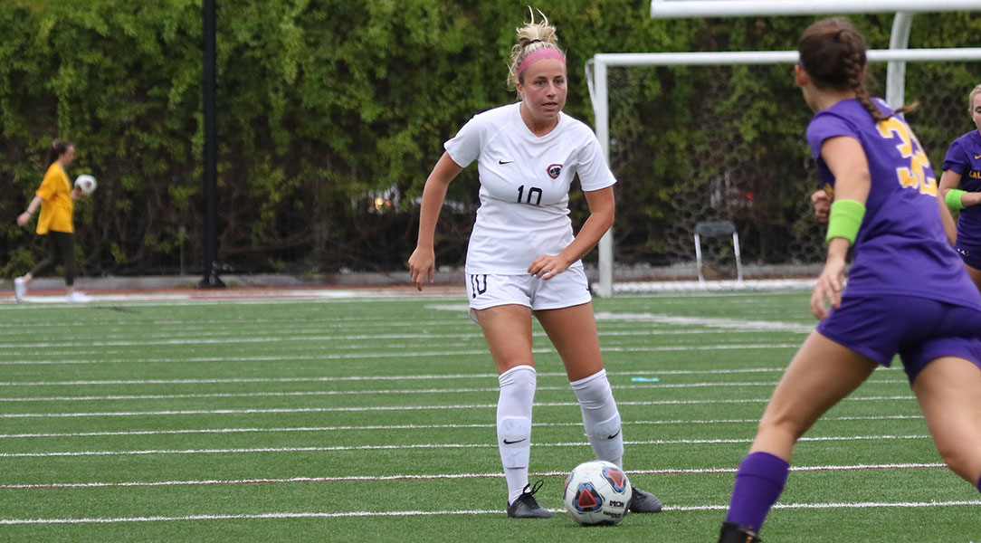 Shelby Brown dribbles the ball.
