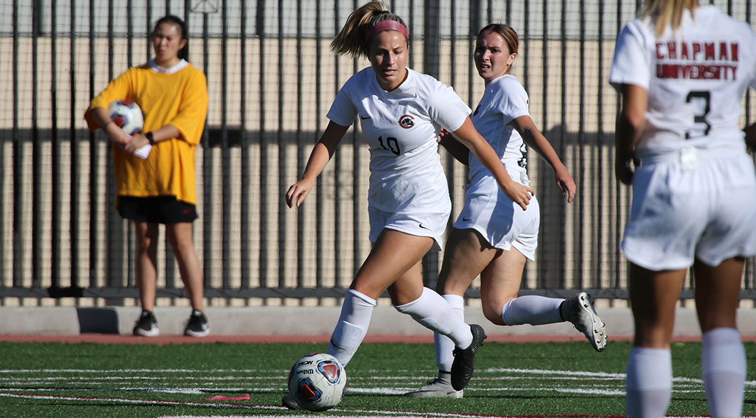 Shelby Brown dribbles the ball.