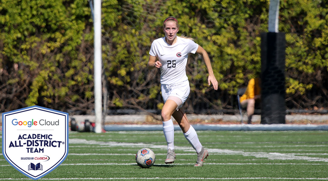 Faith Holloway dribbles the ball.