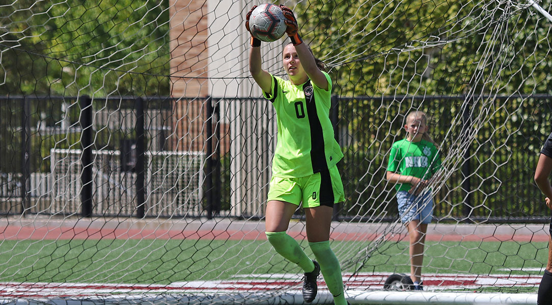 Kelsey Bland grabs the ball out of the air.