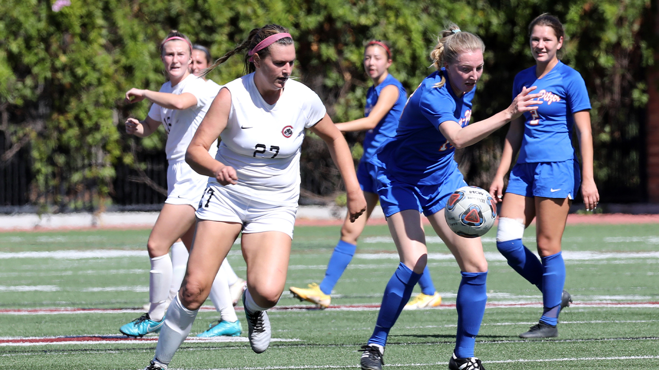 Riley Pidgeon chases the soccer ball.