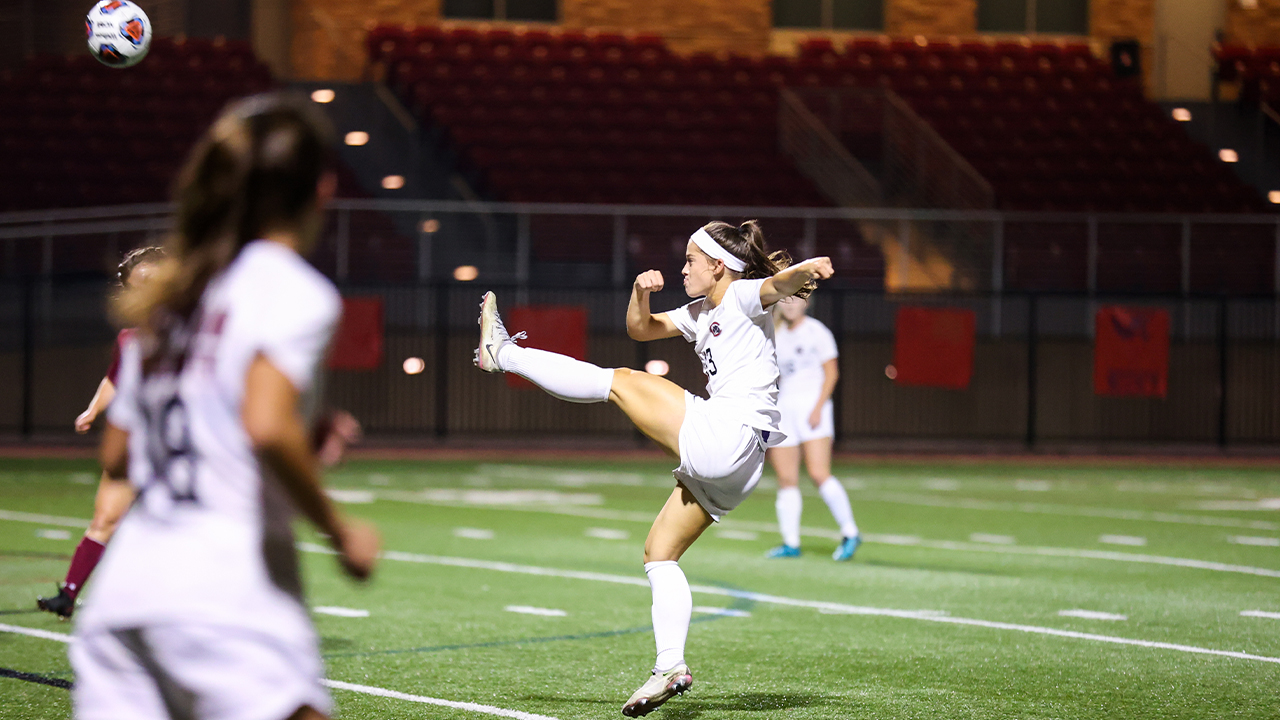 Rory Biles kicks the soccer ball in the air