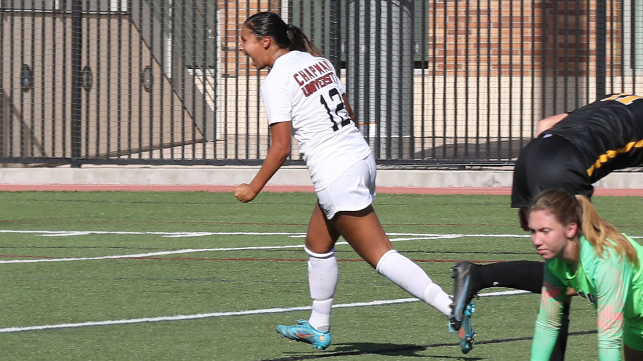 Lily Jose celebrates scoring a goal.