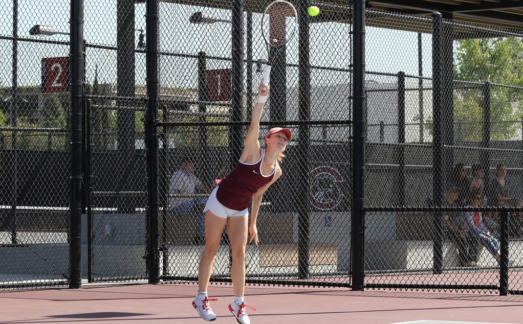 Madison Ross hits a serve.