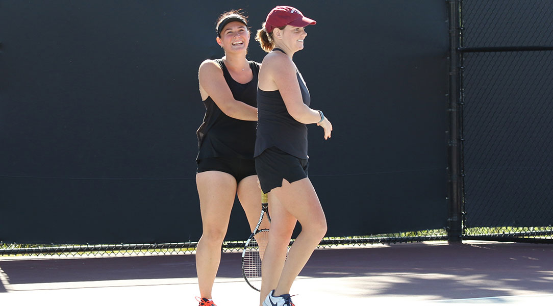 Vasilisa and Nicole celebrate a point.