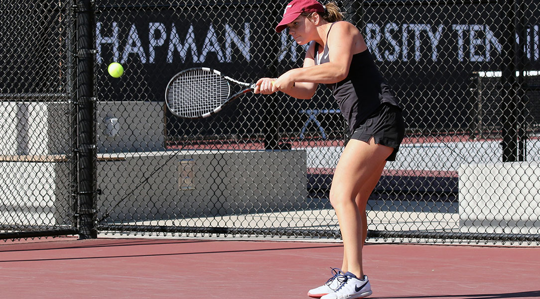 Nicole Fouts hits the tennis ball.