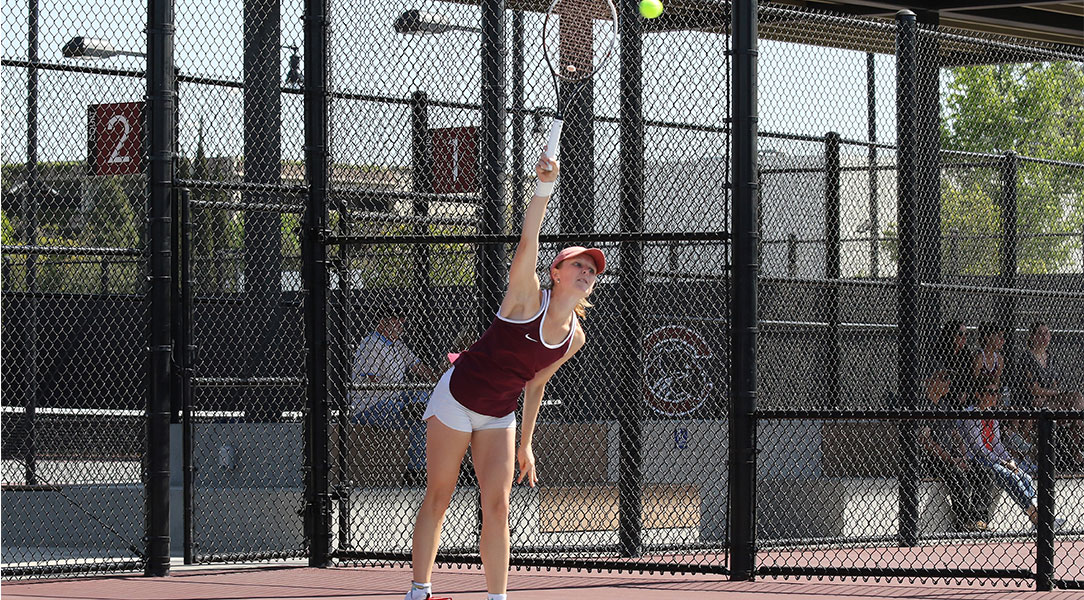 Madison Ross serves.