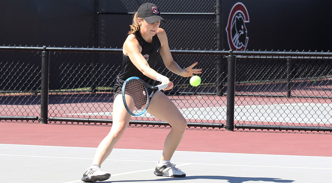 Madison Ross hits the tennis ball.