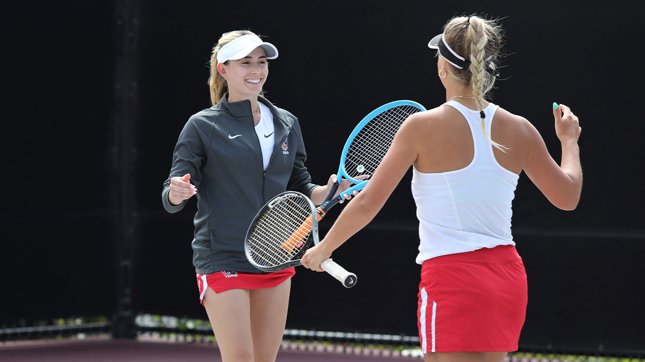 Brooke Waite reached to high five her doubles teammate,