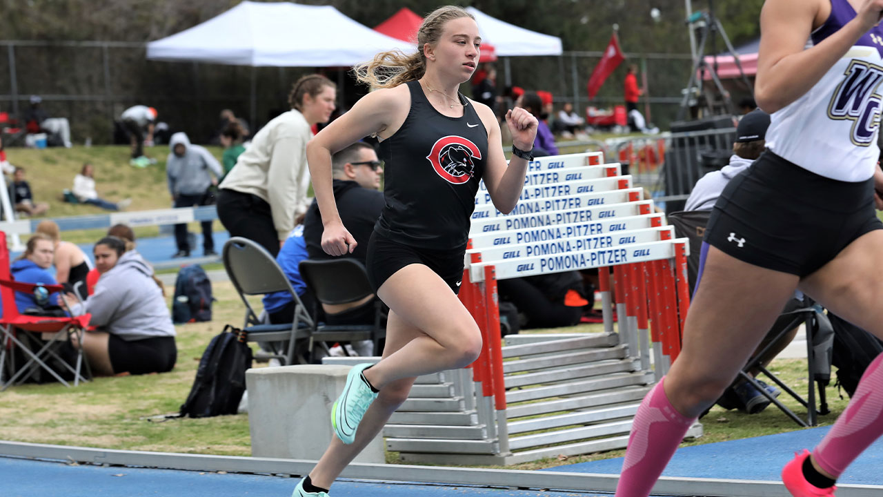 Allie Kremer sprints around the curve of the track.