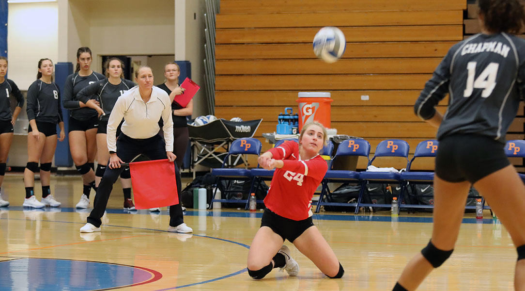 Cat Helgeson digs the ball.